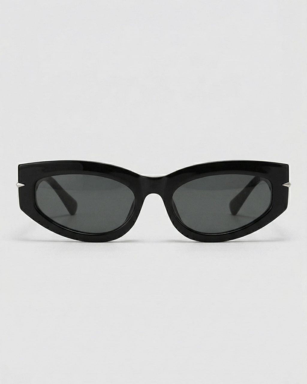 Black cat-eye sunglasses on a light gray background