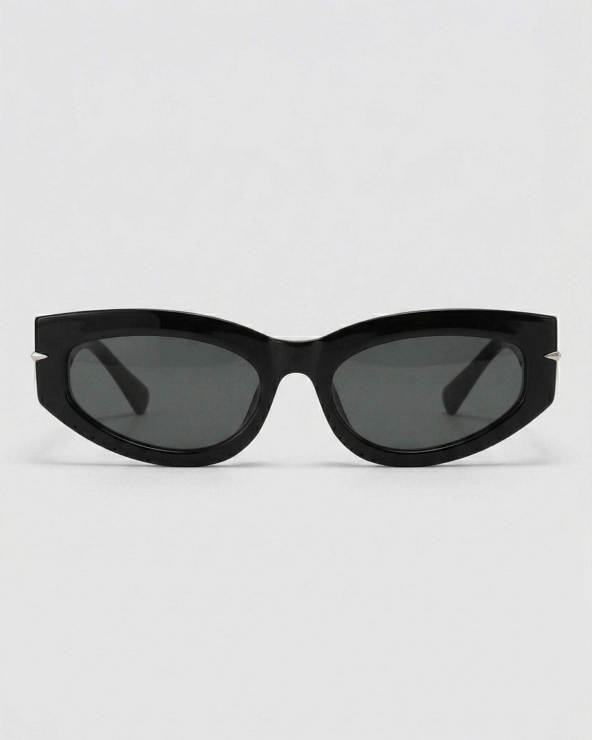 Black cat-eye sunglasses on a light gray background