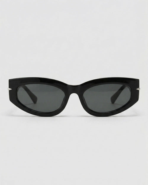 Black cat-eye sunglasses on a light gray background