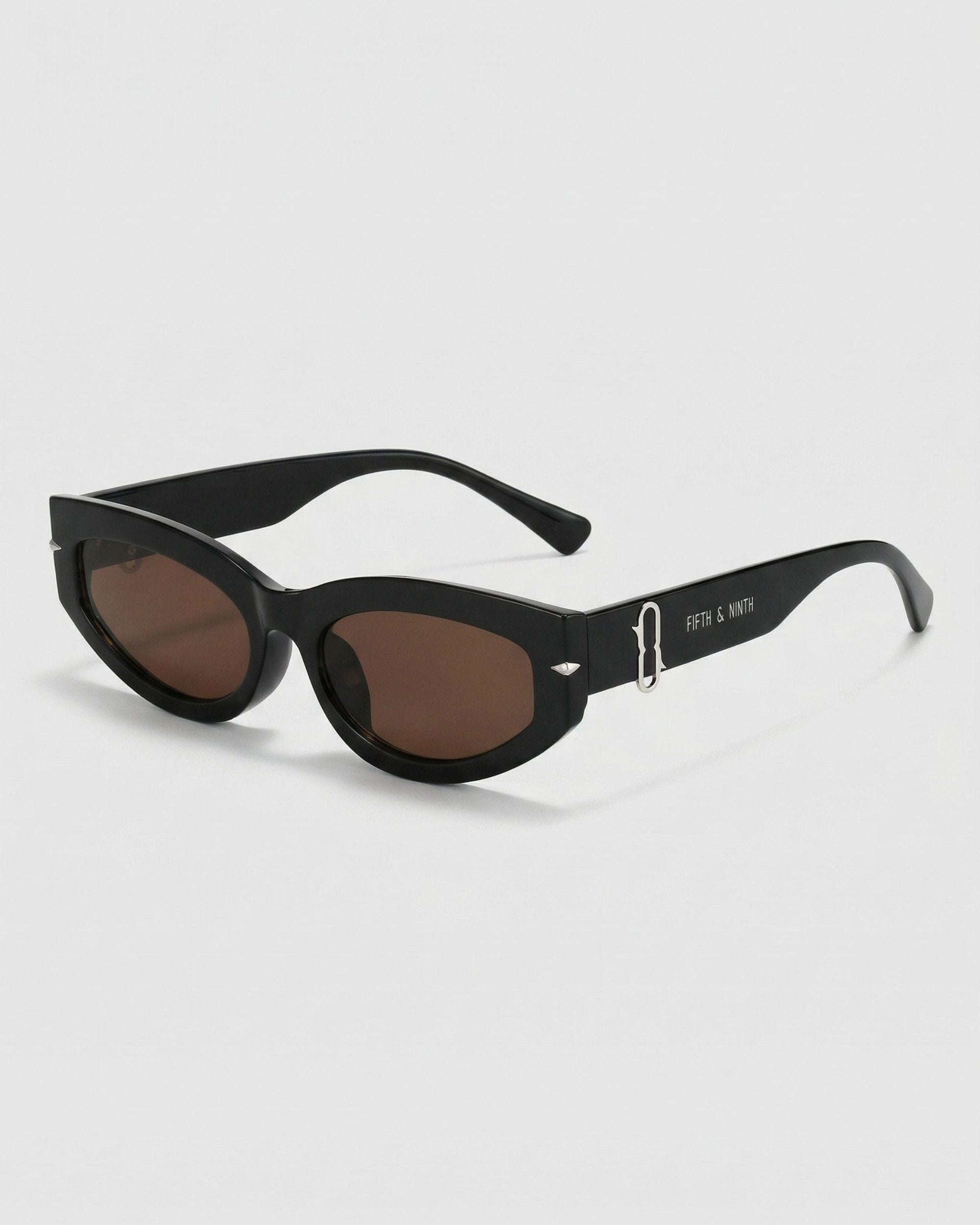 Black sunglasses with dark lenses on a white background