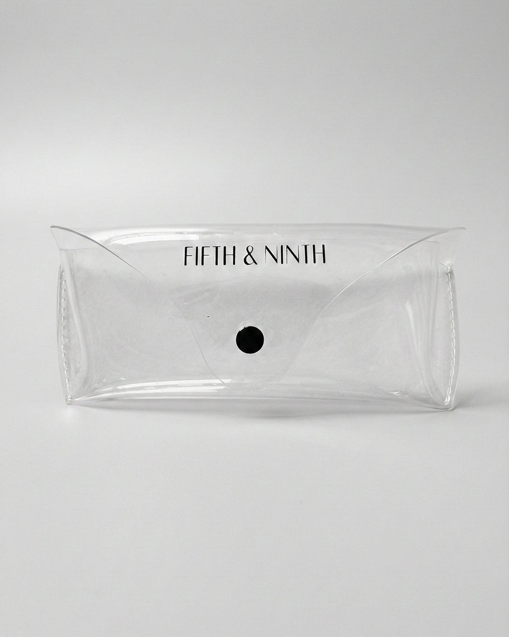 Clear pouch with 'Fifth & Ninth' branding on a white background