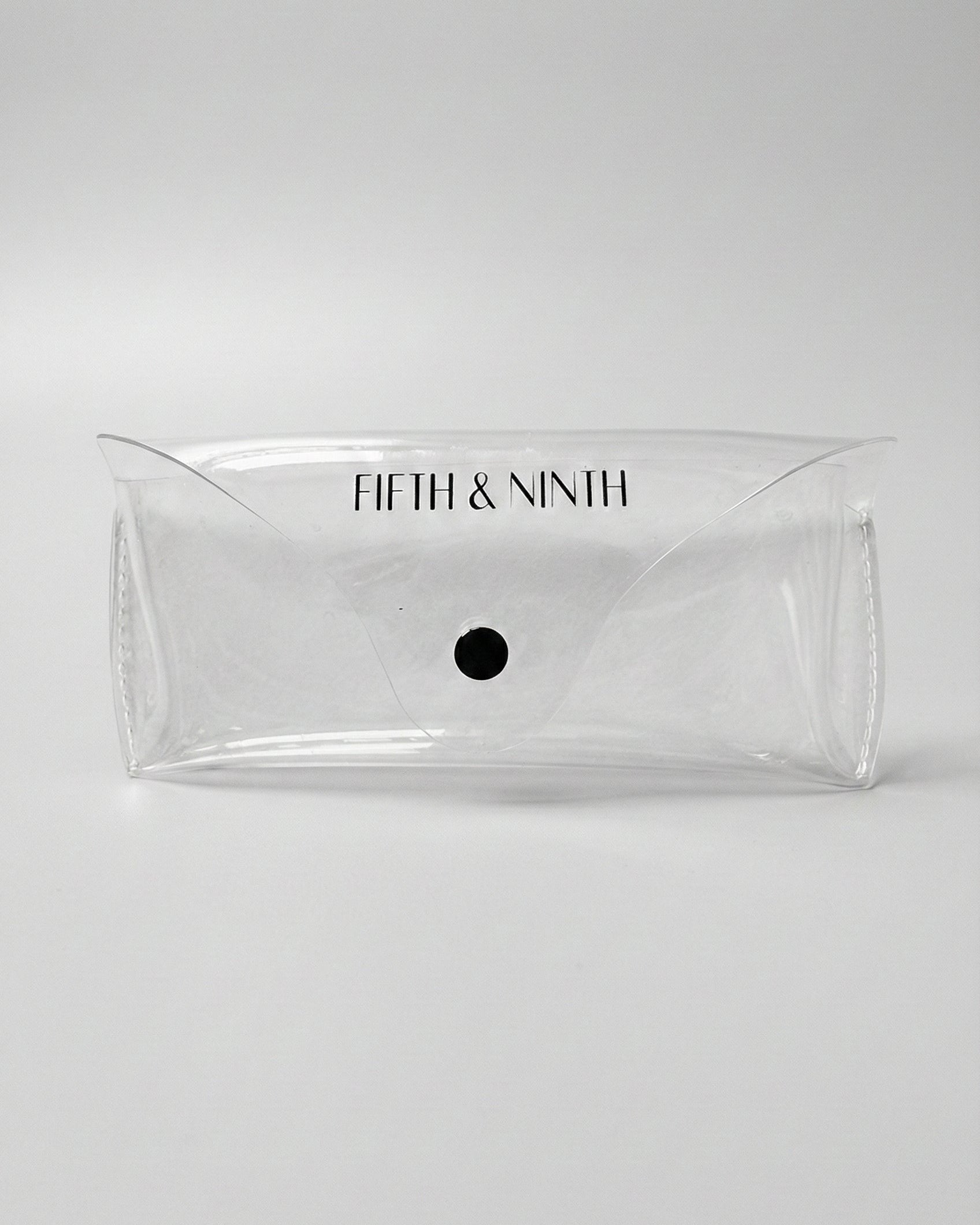 Clear pouch with 'Fifth & Ninth' branding on a white background