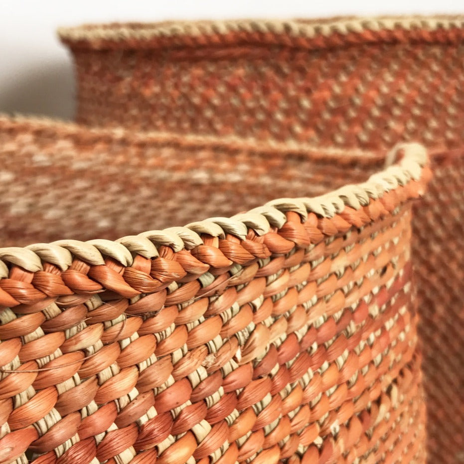 Close-up of a woven basket with a natural brown and beige color scheme.