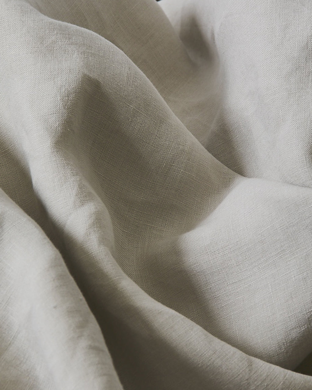 Close-up of beige fabric with folds
