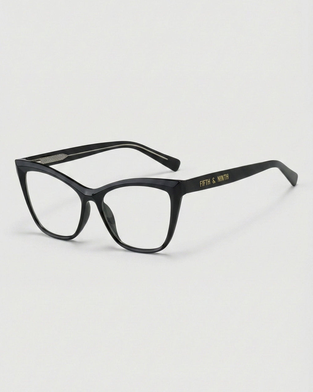 Black eyeglasses on a light gray background