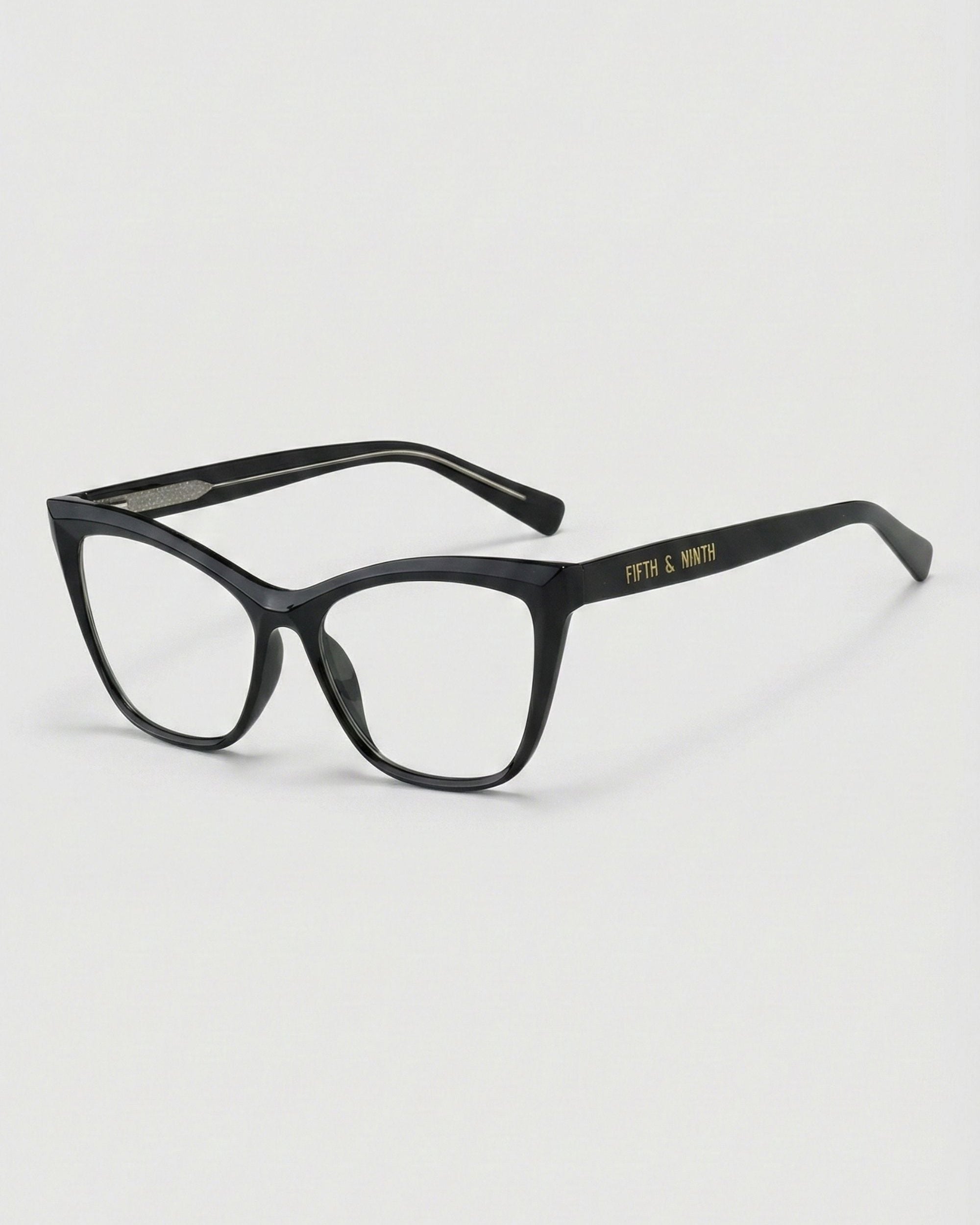 Black eyeglasses on a light gray background