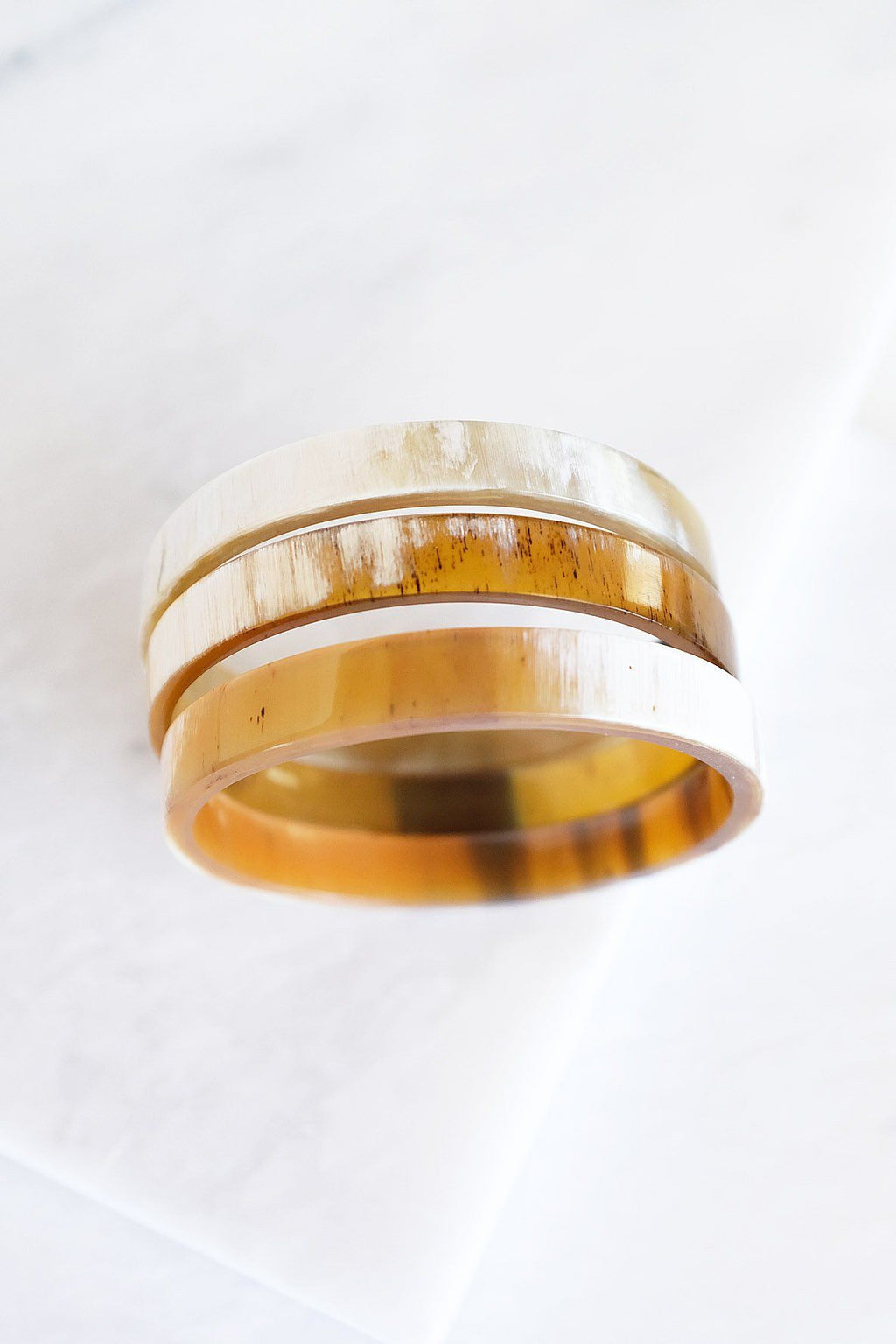 Two-layered ring with a natural wood texture on a white background