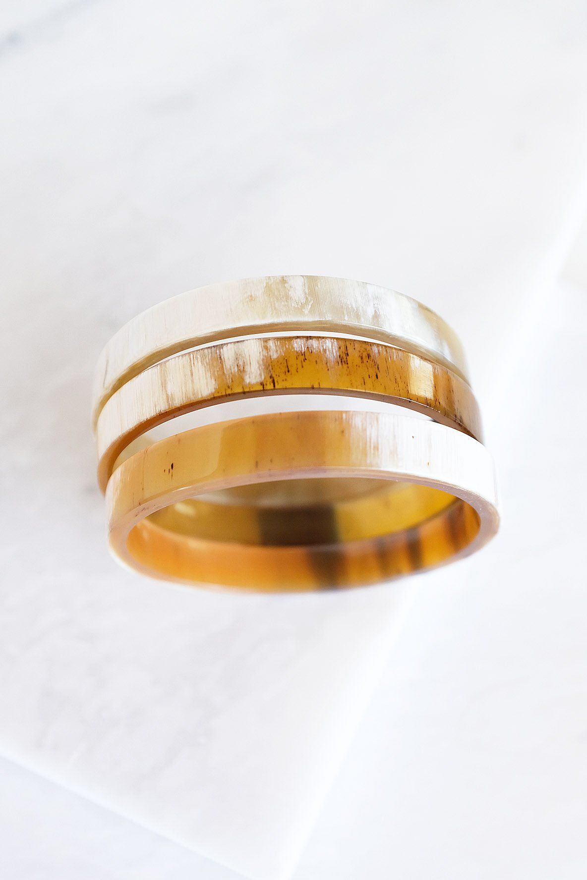 Two-layered ring with a natural wood texture on a white background